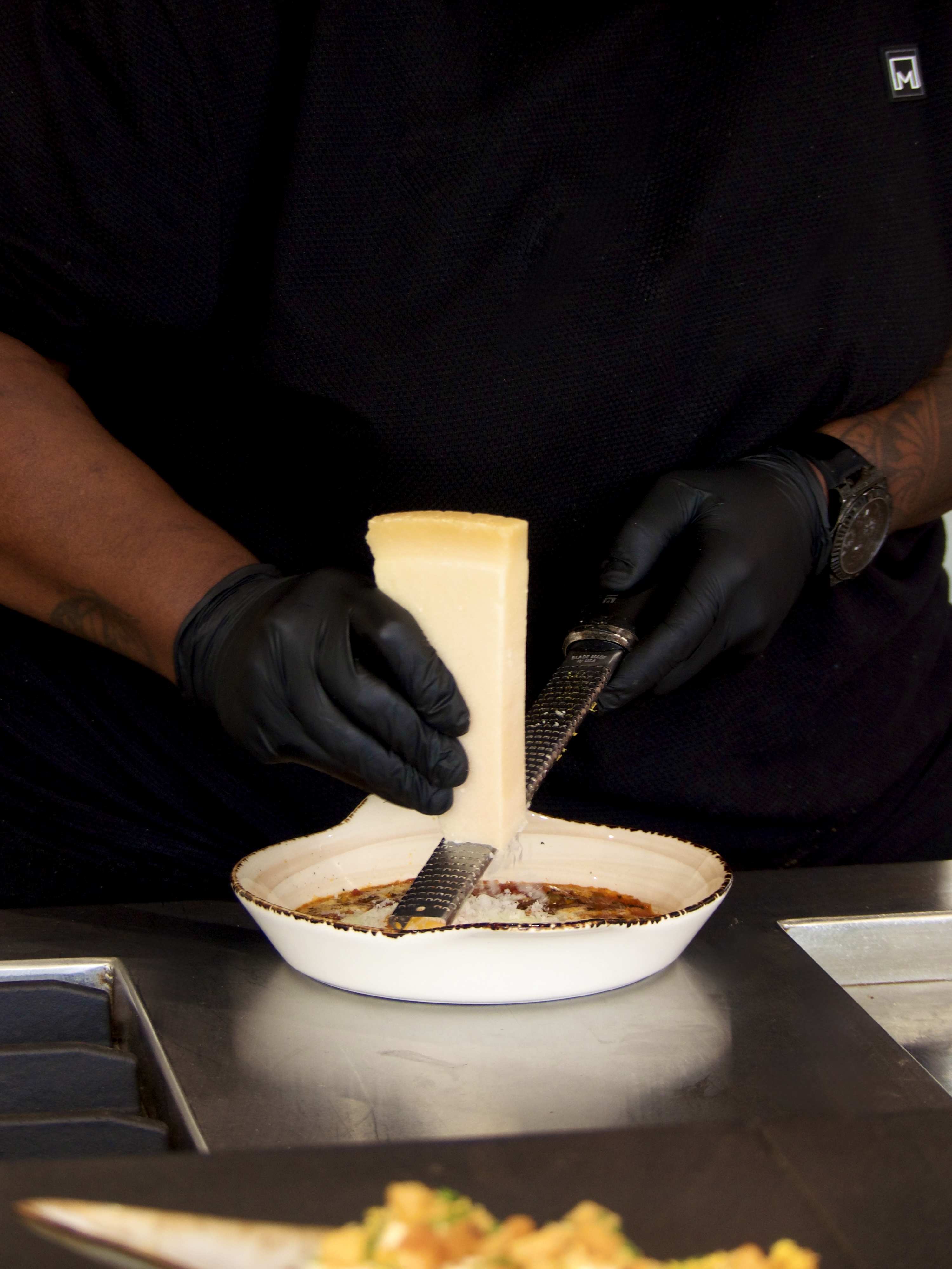 El Canton chef grating fresh parmesan